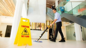 man cleaning the floor of shopping mall